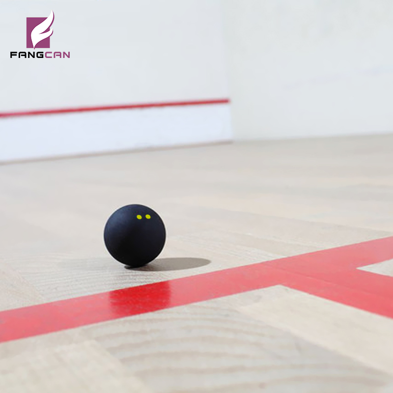 Squash ball on a court floor