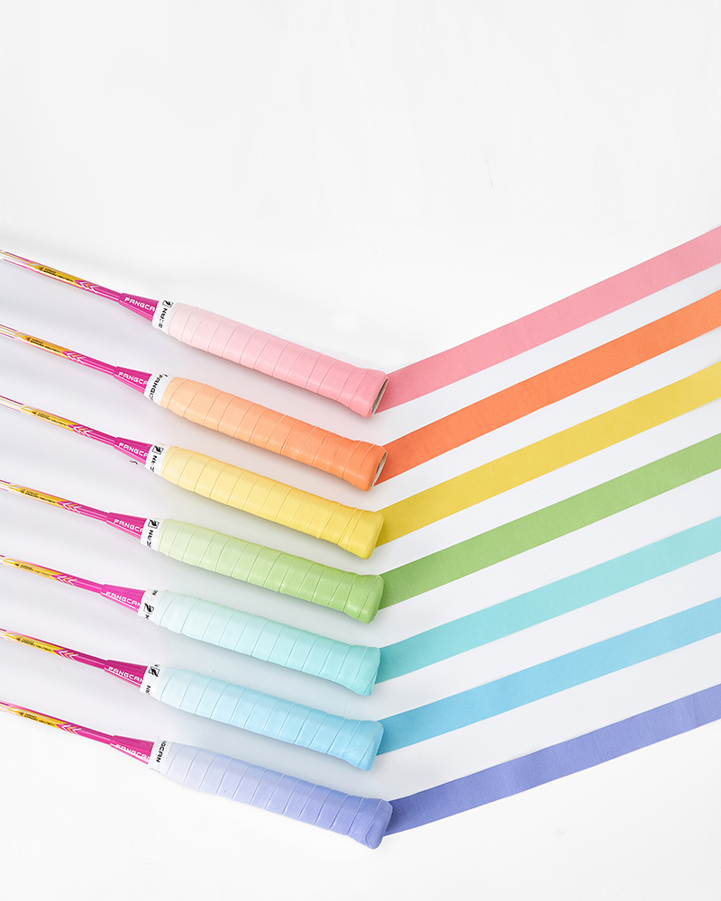 Gradient overgrip wrapped on handles, with an unwrapped strip showing the colour fade